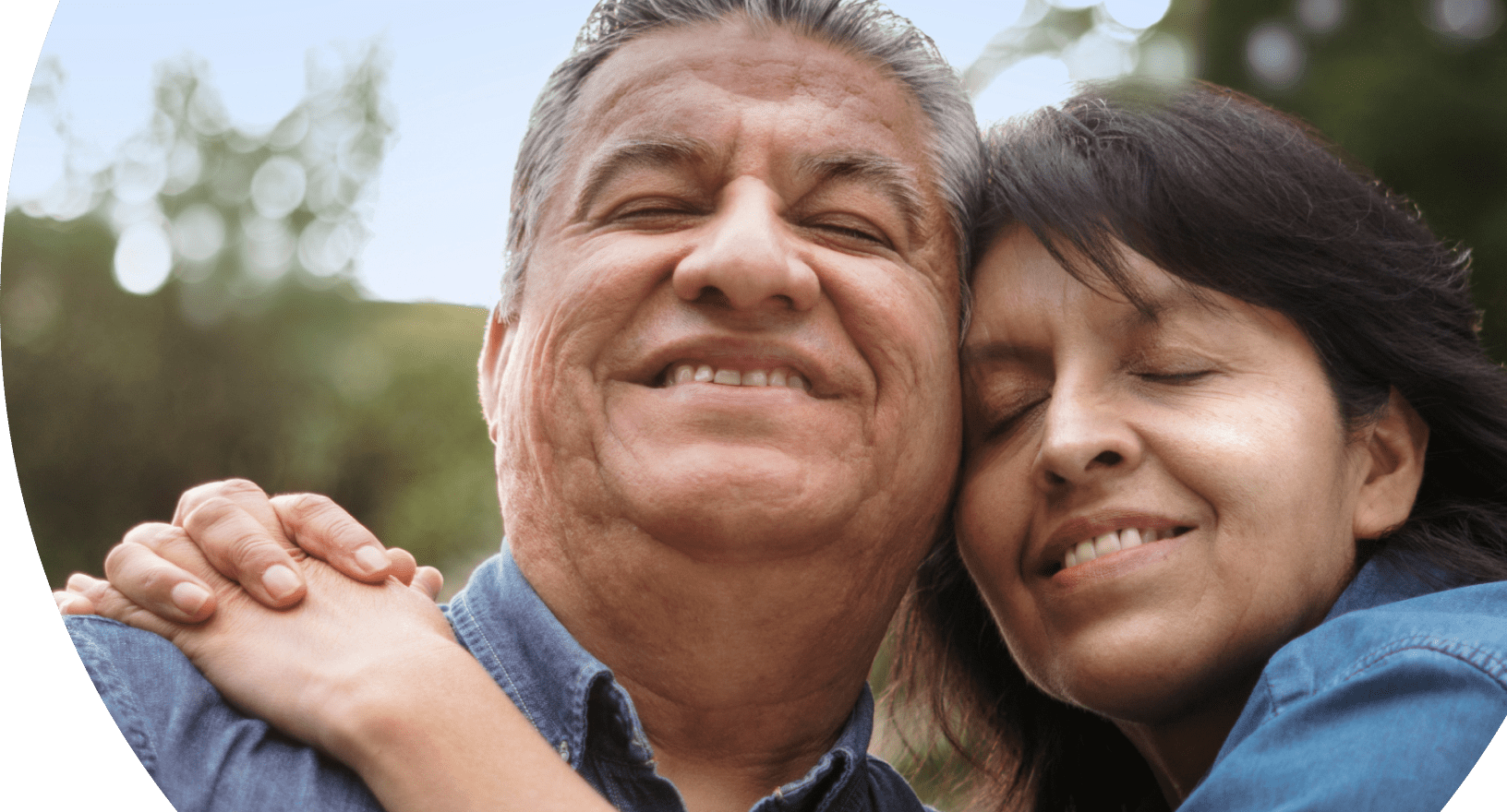 Caregiver and their partner with agitation in Alzheimer's dementia warmly embracing